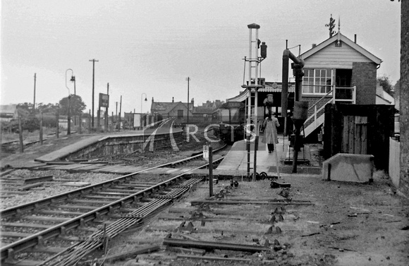 PG01909 - View looking south towards Bridport station with a DMU in the platform c early 1970s