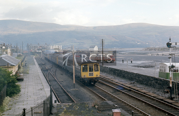 LAN0297C - View of Barmouth station approach with DMU passing c October 1974