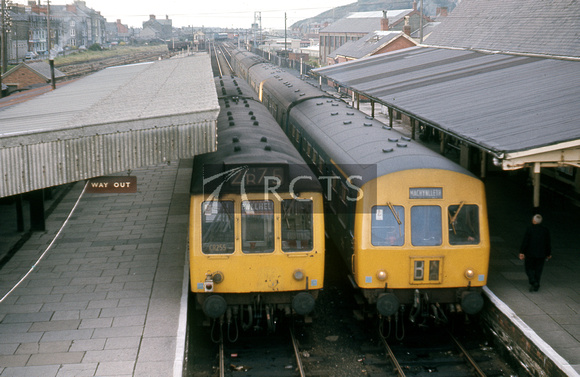 LAN0298C - Barmouth station viewed from an overbridge and showing DMUs in the platforms c October 1974