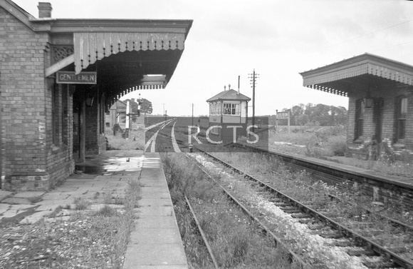 WOOL012 - View along the platform at Adderbury station showing buildings and signal box in the distance 23/6/65