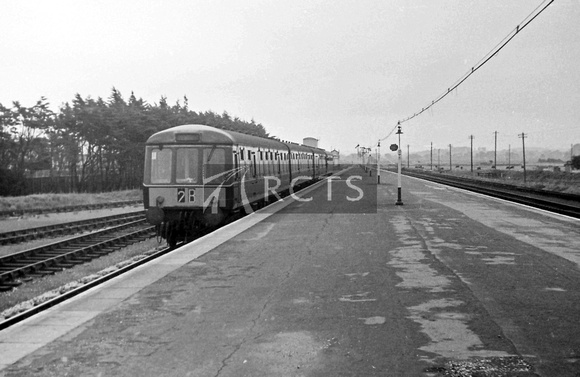 PG02269 - View along the platform looking east at Minehead station with a DMU in the platform c late 1960s