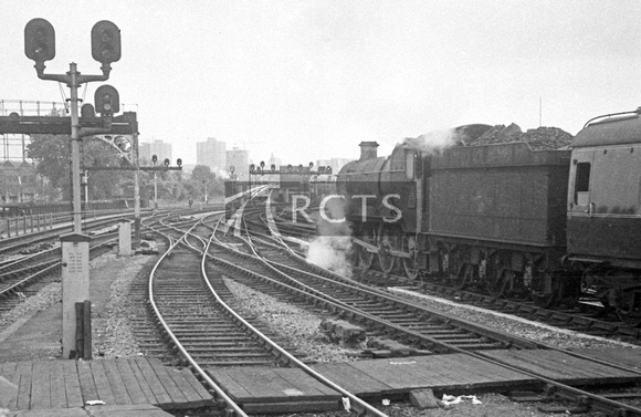 BRO0044 - Unidentified ex-GWR loco on a passenger train leaving an unidentified station, possibly Bristol