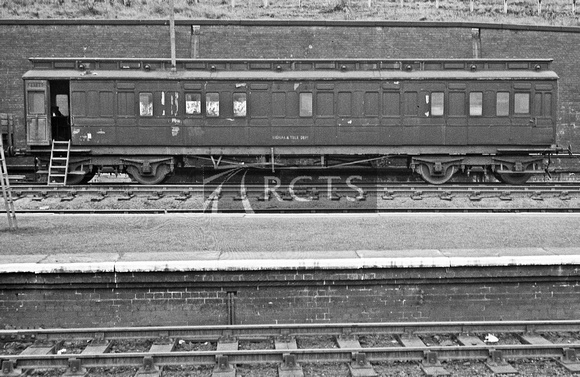 RGW0319 - Ex NER coach (unidentified) in use by the Signal & Tele Dept at Harringay West 21/6/56