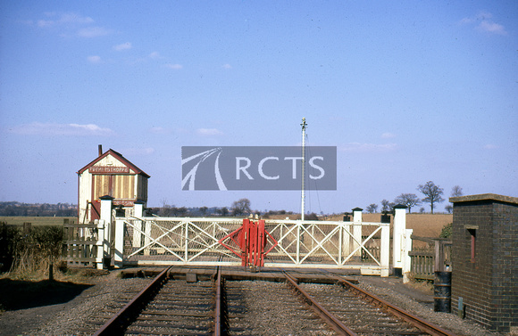 BEL0027C - Rothersthorpe signal box and level crossing (after closure), April 1969