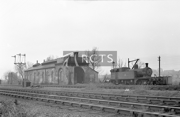 PHW1284 - Stamford GN shed and water tank with Cl C12 No. 67390 outside 30/12/51