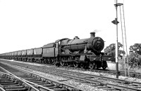 CC00453 - Cl 6959 No. 7915 'Mere Hall' on a train of hoppers c 1960s
