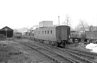 FAI0341 - Rolvenden station showing Cl O1 No. 31065 with train and also showing station, engine shed and part of goods yard 28/12/53