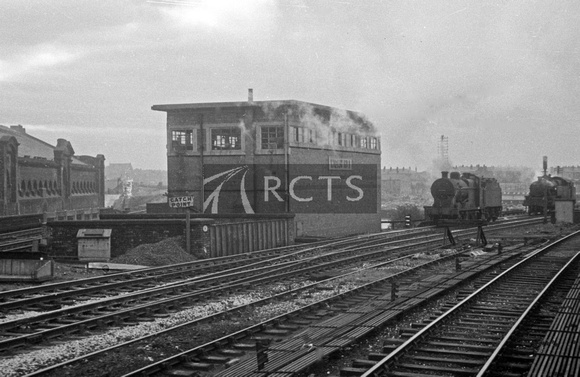 BRO0002 - Wigan No.1 signal box with locos alongside viewed from a train c 1960s