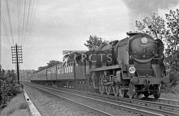 BALD109 - Cl WC (R) No. 34027 'Taw Valley' on a passenger train near Eastleigh c 1960s