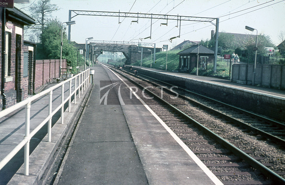 CC00360C - View looking along the platform towards the overbridge at Adlington station c 1970s
