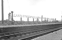 AW00025 - Station name sign at Llanfair PG 18/9/53