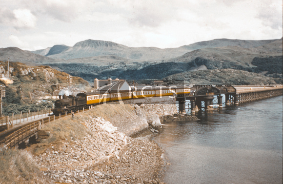 DUN1012C - Cl Dukedog? (unidentified) on a northbound passenger train coming off Barmouth viaduct c 1950s