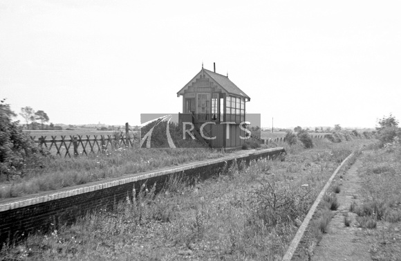 WOOL048 - Distant view of Potter Heigham station signal box 15/7/63